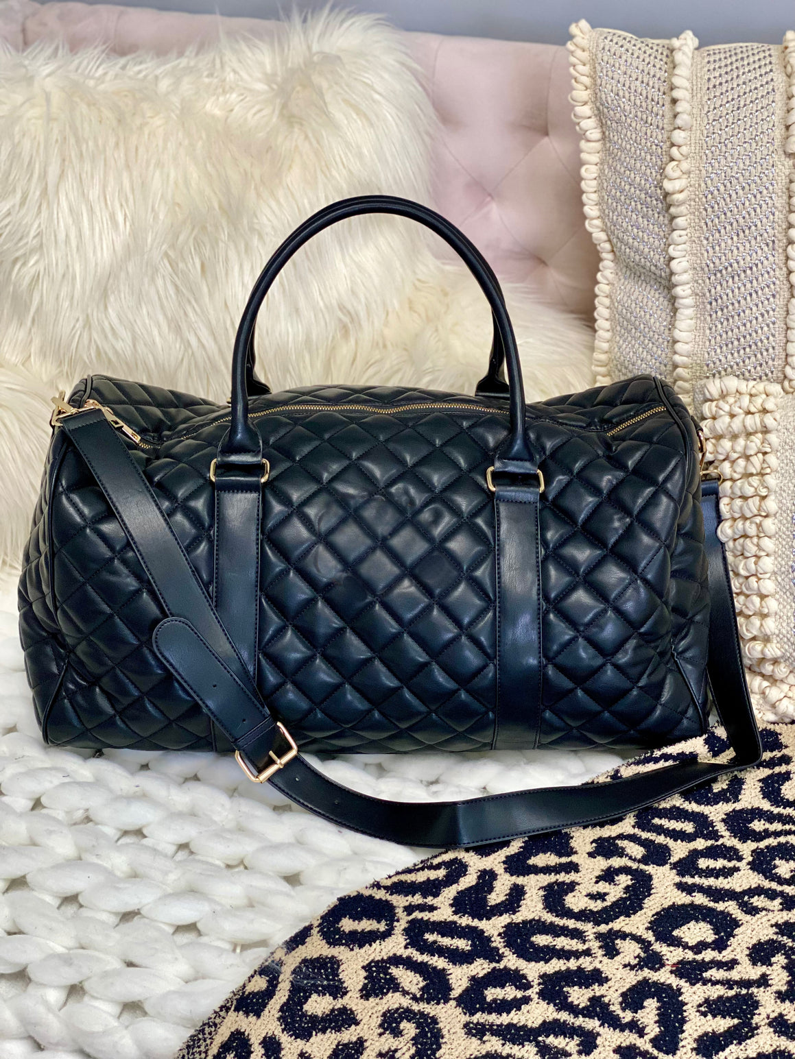 Black quilted duffle bag on sale