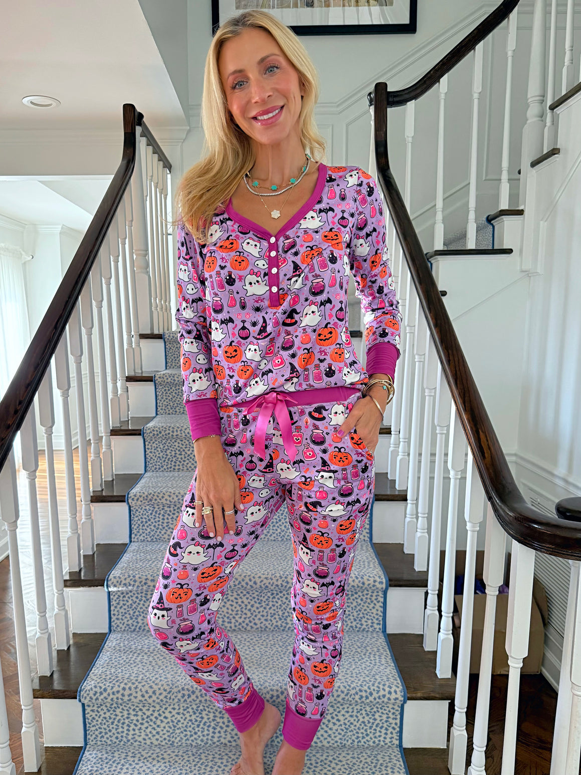 Jordann standing on staircase wearing the Hocus Pocus Ghost Jogger PJ Set by Jordann Jammies 