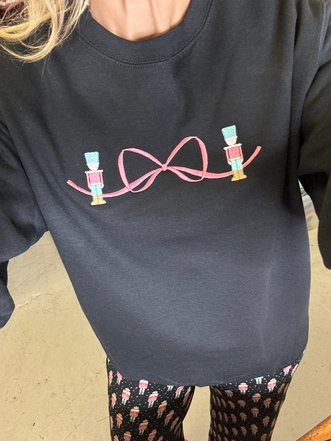 Jordann wearing the Nutcracker Bow Sweatshirt and Nutcracker Pajamas by Sunshine Sisters